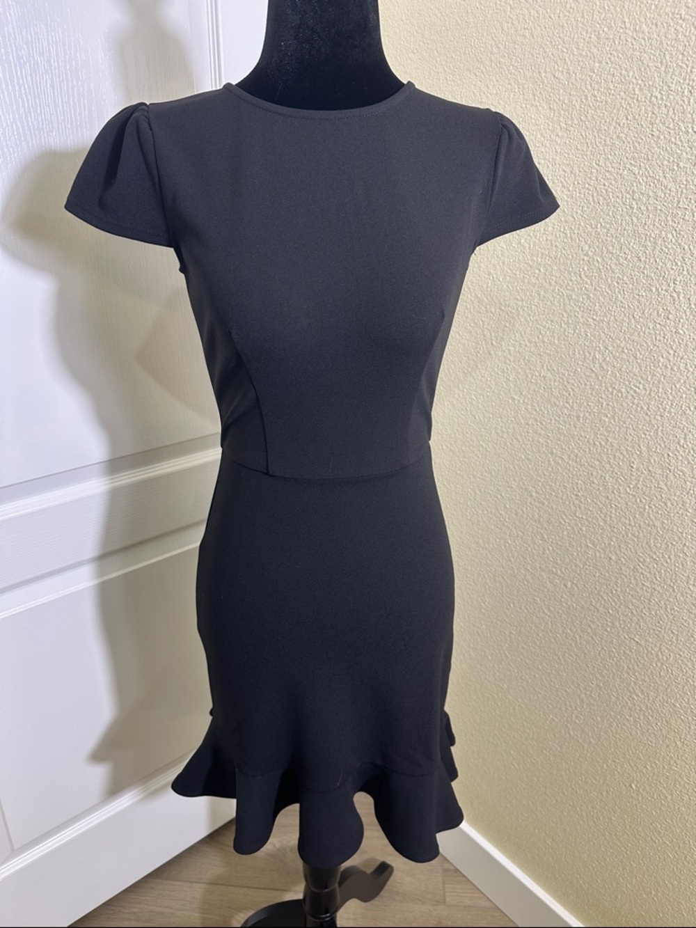 B Darlin Black Classic Fitted Ruffle-Hem Mini Dress. 1/2